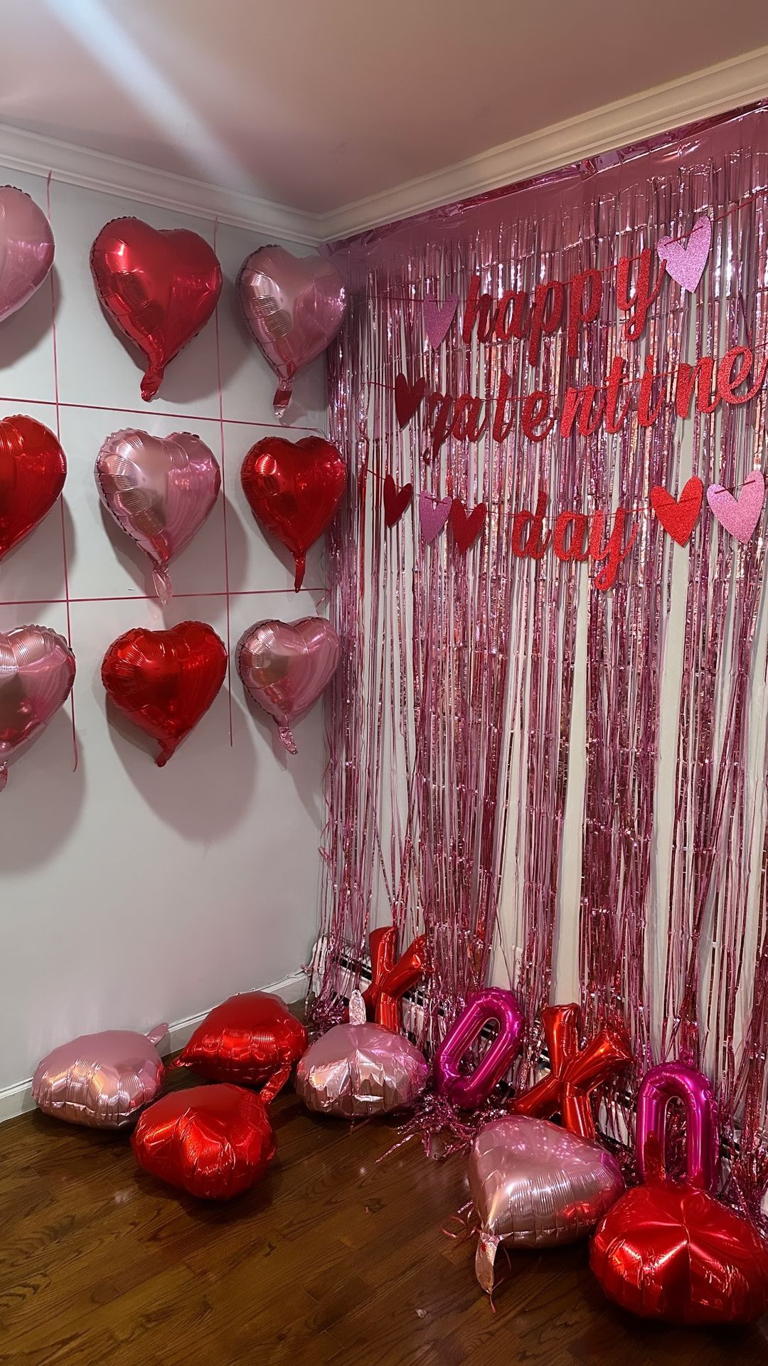 Galentine's Day heart balloon wall with pink fringe